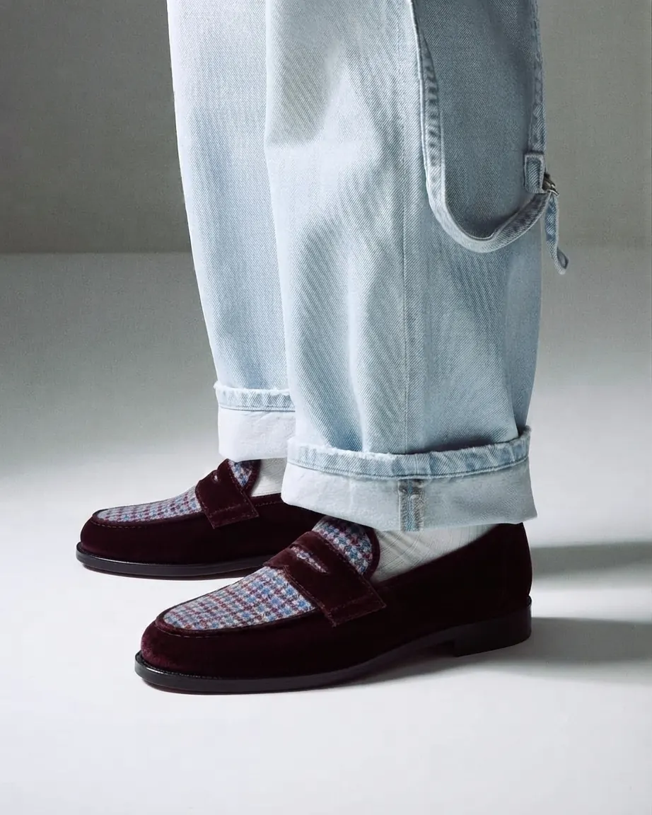 Burgundy velvet LYL penny loafers with a tweed check apron, styled with light-wash denim